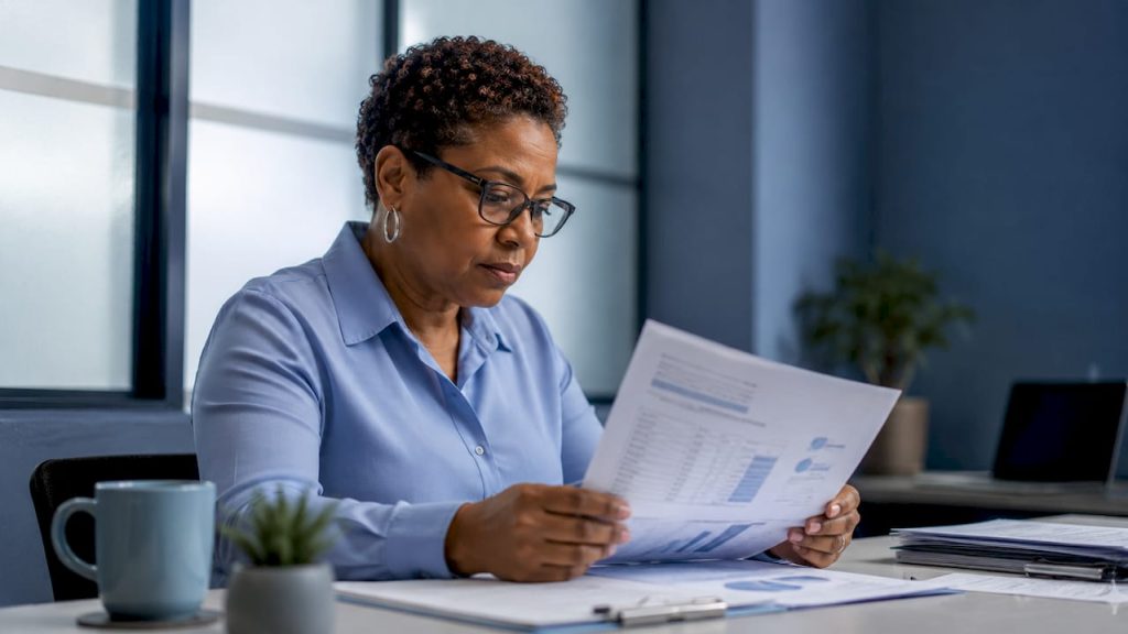 Operations manager reviewing maintenance reports