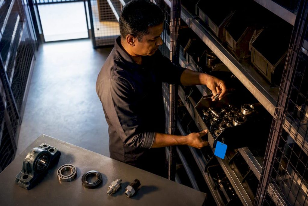 Storekeeper organizing asset-linked maintenance spares