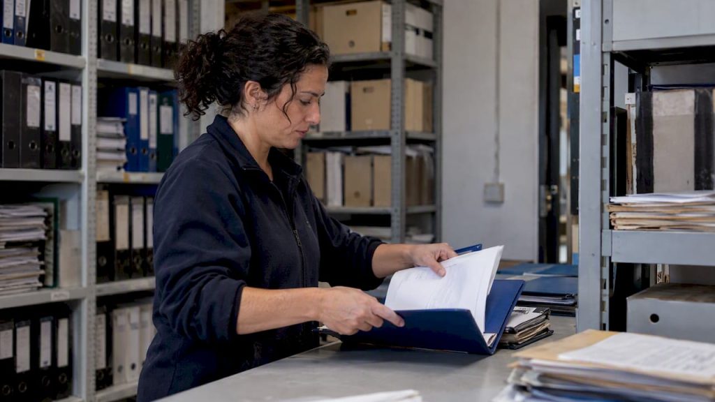Coordinator assembling a maintenance compliance dossier